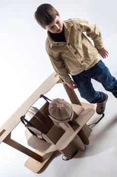 Boy and biplane. Stock Photos