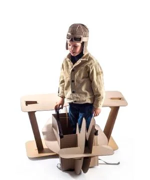 Boy and biplane. Stock Photos