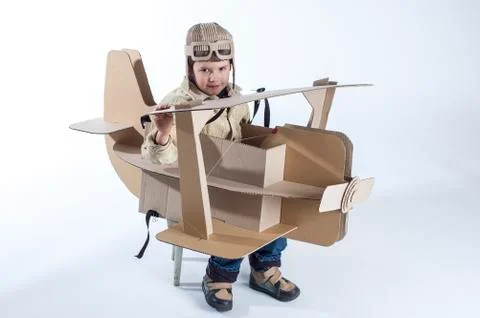 Boy and biplane. Stock Photos
