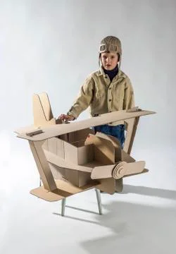 Boy and biplane. Stock Photos