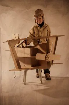 Boy and biplane Stock Photos