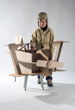 Boy and biplane. Stock Photos