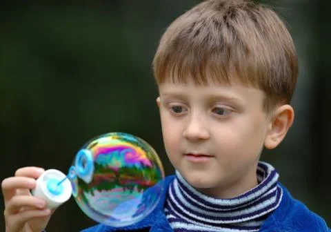 The boy and the bubble Stock Photos