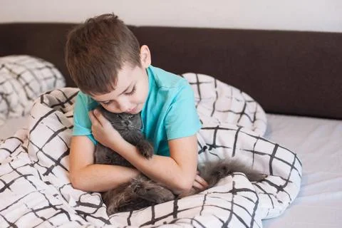 Boy and cat Stock Photos