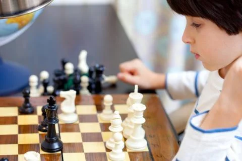 Boy and chess Stock Photos