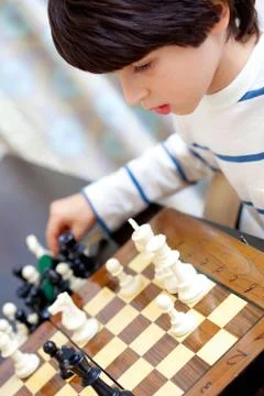 Boy and chess Stock Photos