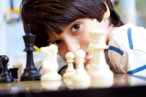 Boy and chess Stock Photos
