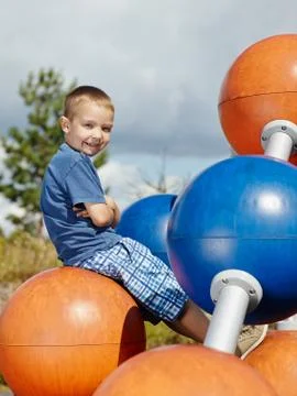 Boy and climbing frame Stock Photos