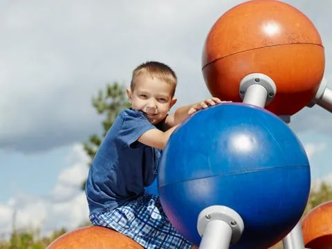 Boy and climbing frame Stock-Fotos