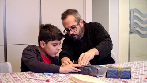 Boy and father making Christmas presents Stock Footage 345253367
