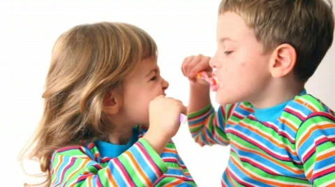 Boy and girl brush teeth Stock Footage