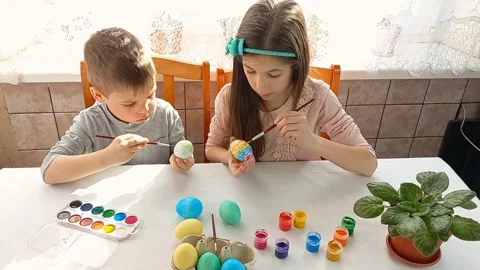 Boy and girl coloring Easter eggs. Stock Footage 171717827
