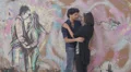 a boy and a girl swear eternal love and kiss, in graffiti on the wall is painted HD Footage