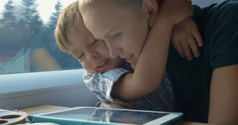 Boy and His Mother Watching Cartooins in Tablet Stock-Footage 52381553