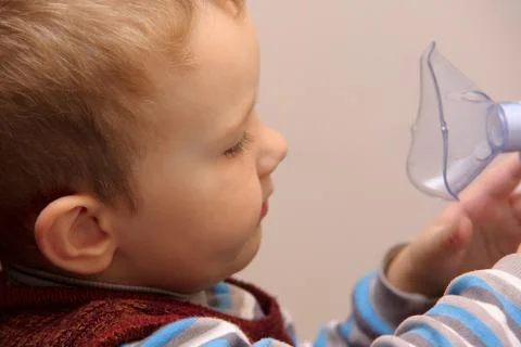 Boy and inhaller Stock Photos