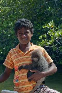 Boy and monkey Stock Photos