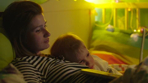 Boy and Mother Resting in Bed with Laptop Stock Footage 56726930