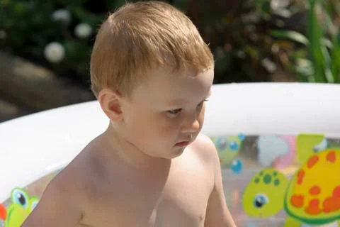Boy and  the pool Stock Photos
