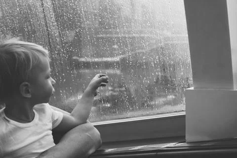 The boy and the raindrops Stock Photos