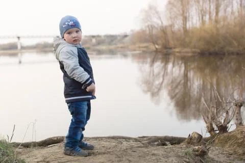 Boy and river Stock Photos