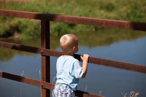 Boy and river. Stock Photos