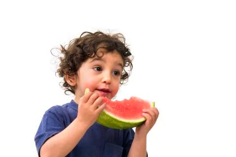 Boy and watermelon Stock Photos