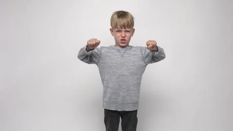 Boy with angry expression on white background Stock Footage 282201430