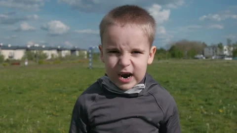 Boy with angry face screaming from top of his lungs Stock Footage 131095783
