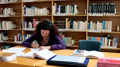 Boy is annoying girl while studying Video stock 22165584