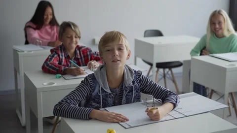Boy answering question during lesson Video stock 142494458
