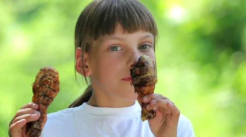 Boy with appetite eats chicken feet.Child eating chicken feet. Stock Footage 38797216
