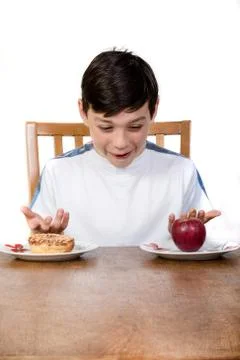 Boy With Apple &amp; Donut Stock Photos