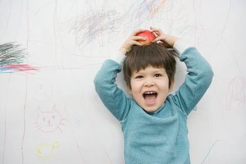 A boy with an apple on his head Stock Photos