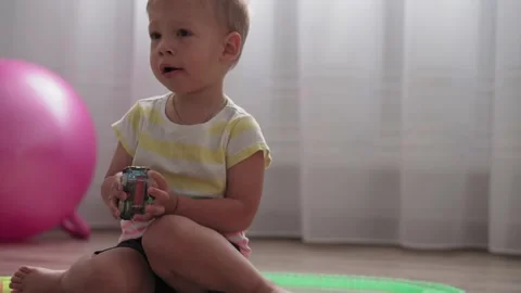 Boy are playing with constructor of race track with toy motorized car Video stock 137779001