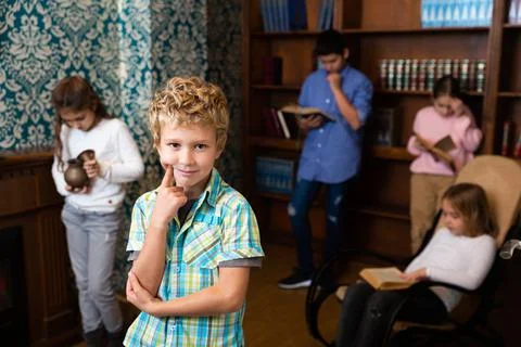 Boy are thinking about solving a problem in quest room Stock Photos