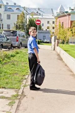Boy are walking with school backpack Stock Photos