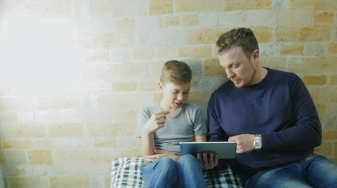 The boy asked his father to help him with homework Stock Footage 62066703