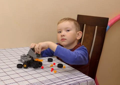 The boy assembles the machine Stock Photos