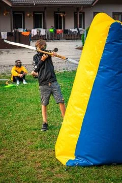 Boy attacking his opponent in a game of archery tag Stock Photos
