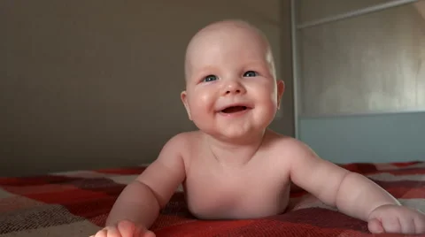 Boy baby naked smiles and laughs | Stock Video