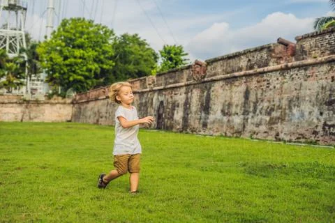 Boy on background of Fort Cornwallis in Georgetown, Penang, is a star fort bu Stock Photos