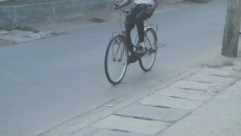 Boy with backpack on bicycle Video stock 108633135