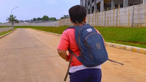 Boy with backpack. running slow motion, back to school concept. Stock Footage 155850197