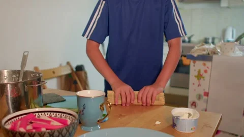 Boy bakes bread, Child eagerly working with flour and rolling pin Stock Footage 321027884