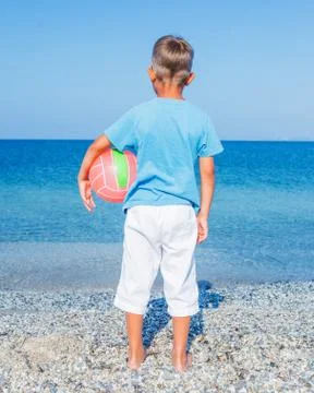 Boy with ball at the beach Foto stock