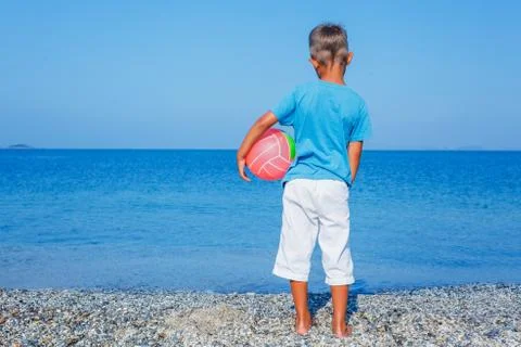 Boy with ball at the beach 写真素材
