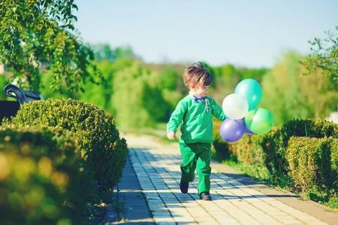 Boy with baloons Stock Photos