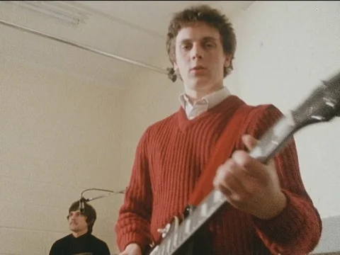 Boy band playing on instruments and singing, London, 1985 Stock Footage 134026572