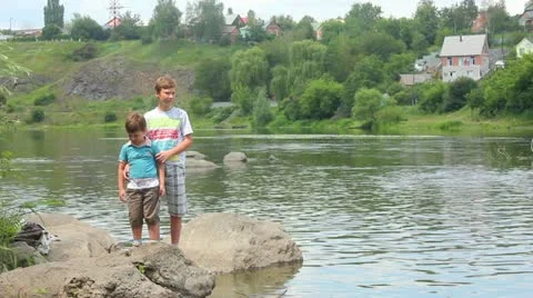 The boy on  bank Stock Footage 11275693