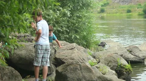 The boy on  bank Stock Footage 11275706